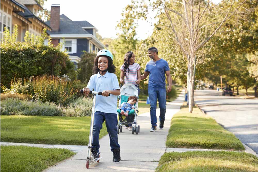 Family of four out for a neighbourhood walk