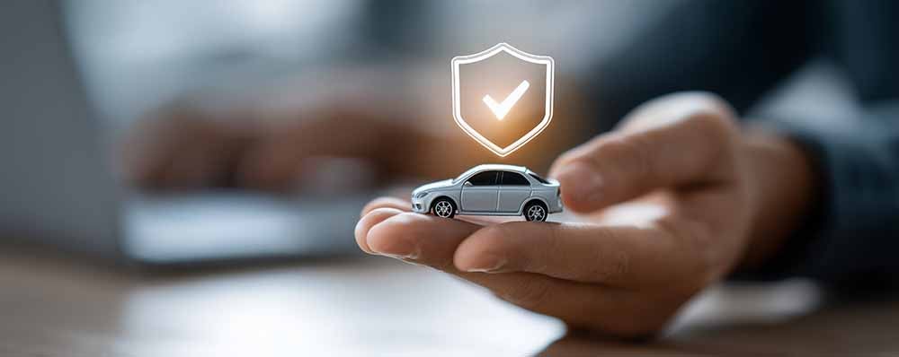 Hand holding a protected car
