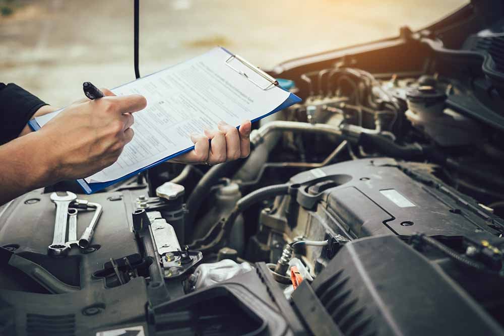 Car mechanic repairing vehicle engine working job.