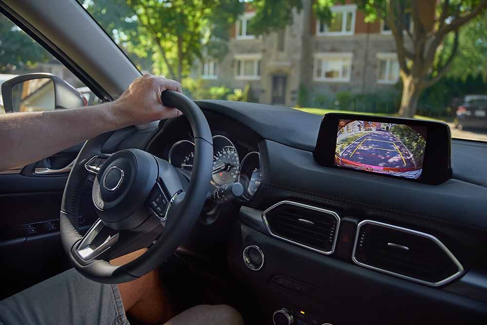 Rear View Monitor for car reverse system. Rear area image showing to driver by video camera at rear area to help for parking and prevent accident. Automotive safety technology equipment.