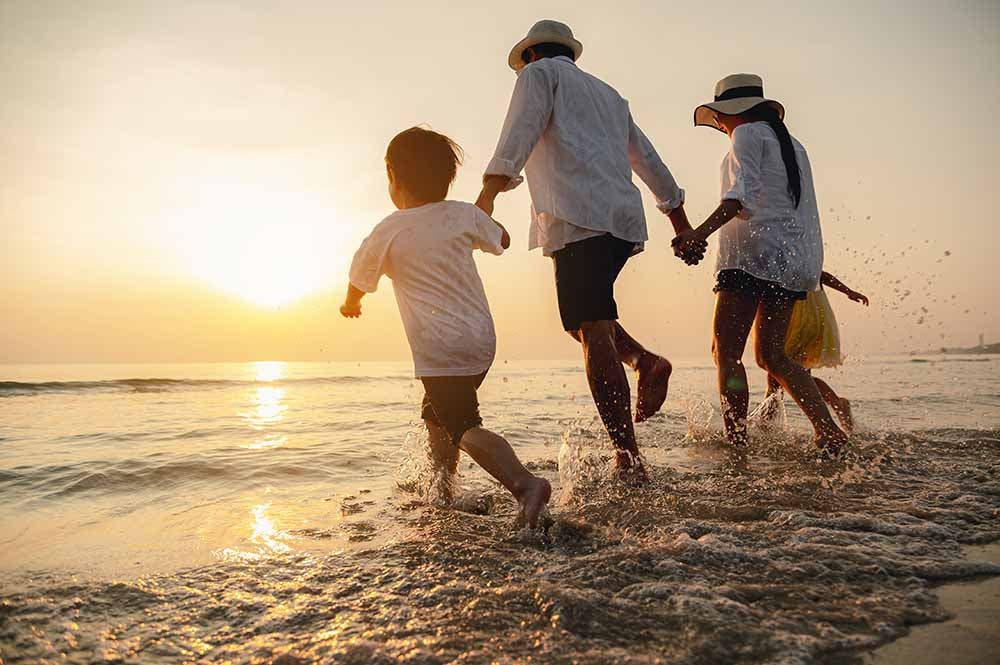 Young family on vacation at the beach