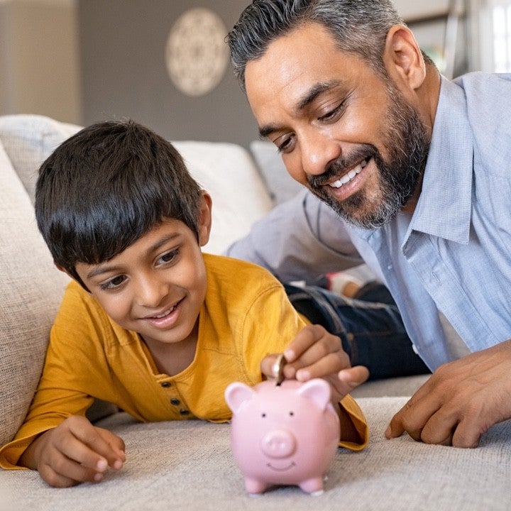 HOME_dad_son_with_a_piggy_bank