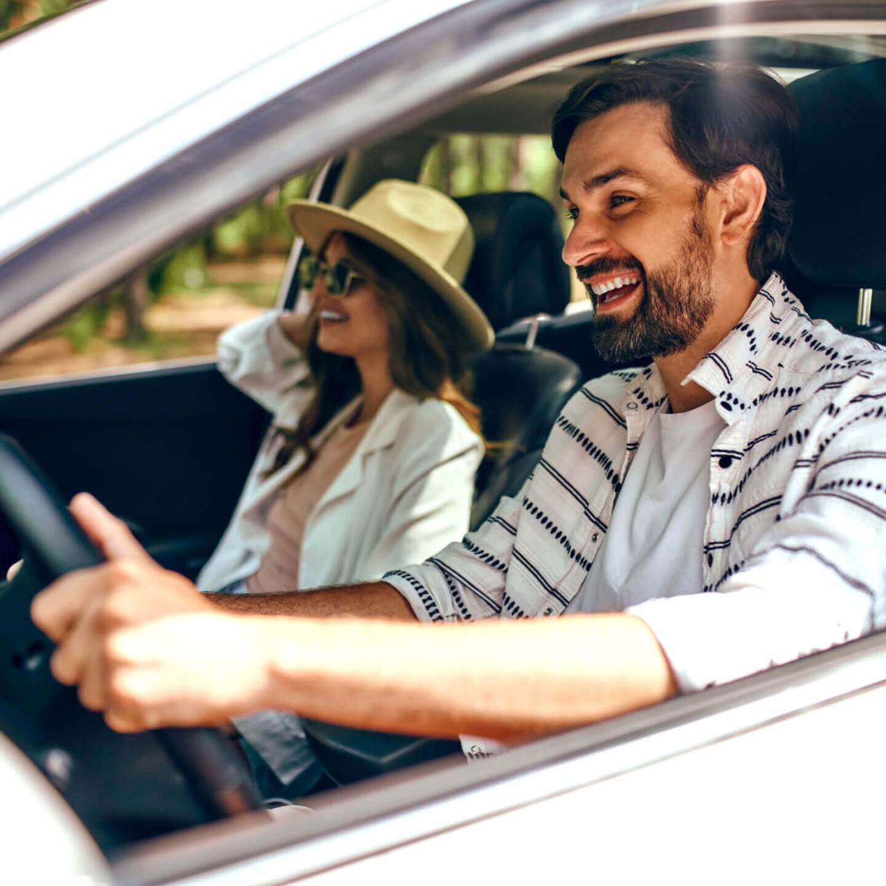 Need FR: "A couple driving in their car covered by usage-based insurance."